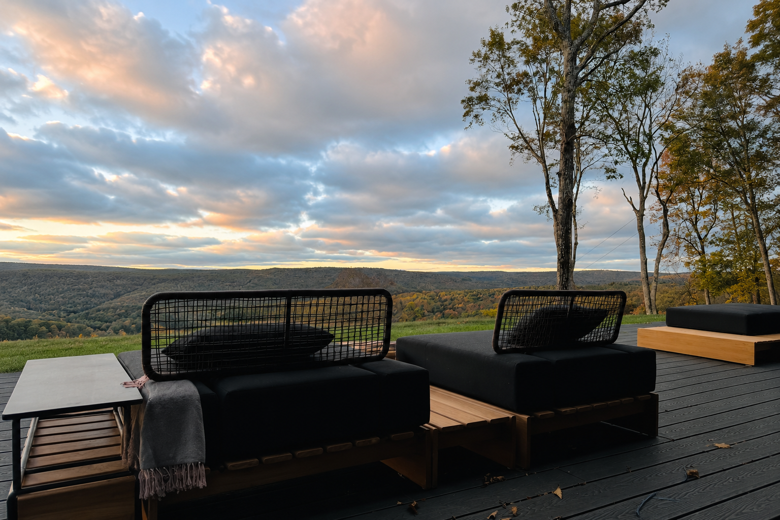 Outdoor deck lounge at sunset overlooking the Catskills mountains