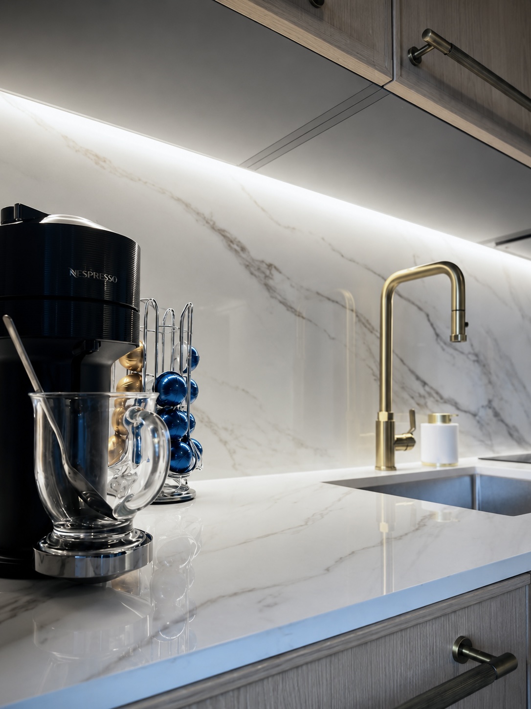 Nespresso machine and complimentary coffee on the marble counter