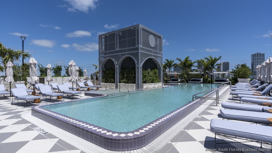 Rooftop pool with cabana and lounge chairs